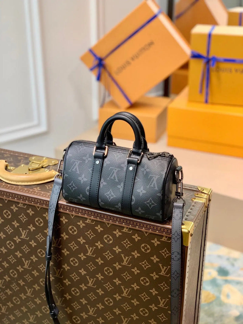 Black leather louis vuitton speedy 30 handbag with monogram canvas and gold-tone hardware.