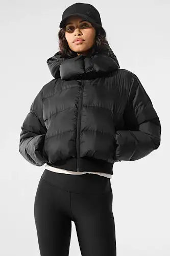 Black puffer jacket with a hood and quilted design.