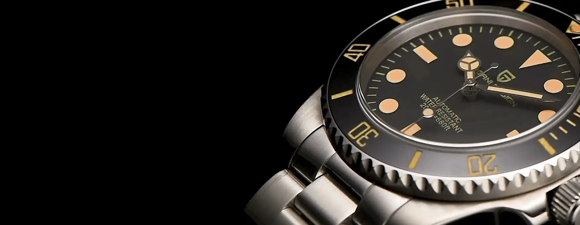 A sleek, stainless steel tudor submariner watch with a black dial and luminous orange hour markers.